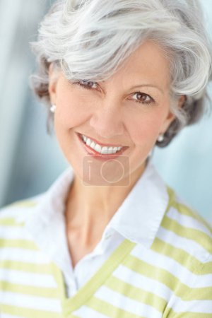 Photo for Elderly woman, portrait and relax in home on weekend, satisfaction and confident for peace or calm. Female person, comfortable and smile in retirement, wellness and happy in apartment for good mood. - Royalty Free Image