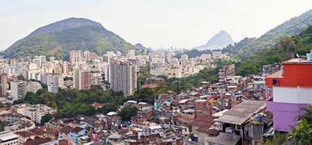 Drone, city and development or informal housing, architecture and infrastructure for urban settlement. Town, location and outdoor for tourism travel in aerial view, property and favelas in Brazil.