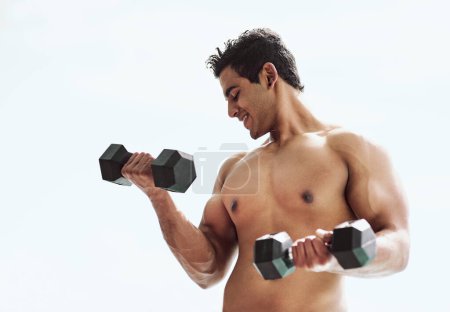 Photo for Dumbbells, bodybuilder or Indian man in outdoor fitness training, exercise or workout for lifting. Arm development, challenge or happy topless athlete with weights for muscle, power or body growth. - Royalty Free Image