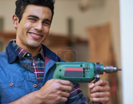 Photo for Man, Carpenter and drilling in portrait with smile in workshop, renovation or maintenance services. Male contractor, power tool and happiness for job in construction, home project or repair work. - Royalty Free Image