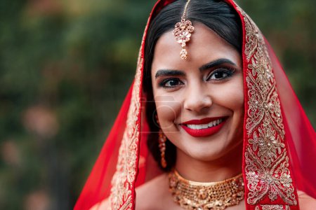 Indian, bride and wedding portrait for celebration and marriage event with Hindu fashion and style. Jewelry, makeup and woman with traditional culture and cosmetics with dress and saree for religion.