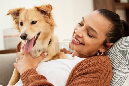 Photo for Home, dog and woman on sofa with love for happiness, relax and playing together for support. Best friend, pet and girl on couch for weekend rest with loyalty, wellness and animal care in apartment. - Royalty Free Image