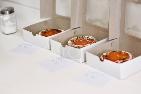 Sweet, takeaway and bakery with order, pastry and boxes with food, snack and cake. Kitchen, business product and dessert with cardboard, fresh treat and package with confection, edibles and apple pie.