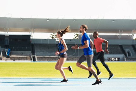 Group, athletes or running on track with diversity for long distance, fitness or exercise and training. Team, stadium or people together for race or marathon, sport or workout with goal for cardio.