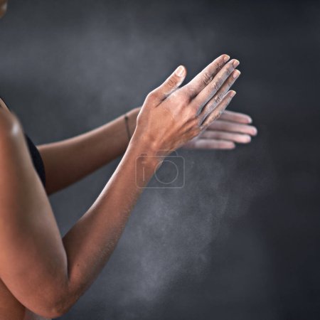 Photo for Hands, person and powder for performance, fitness and strength for training and wellness in gym. Bodybuilder, dust and exercise or workout for health, sports and grip for weight lifting or self care. - Royalty Free Image