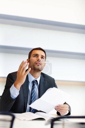Frustrated businessman, lawyer and thinking with documents for legal rights or proposal at office. Man, employee or corporate attorney with paperwork for contract, agreement or statement at law firm.