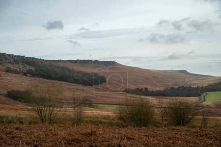 Photo for Paragliding at Stanage Edge in the Derbyshire Peak District National Park during winter. - Royalty Free Image