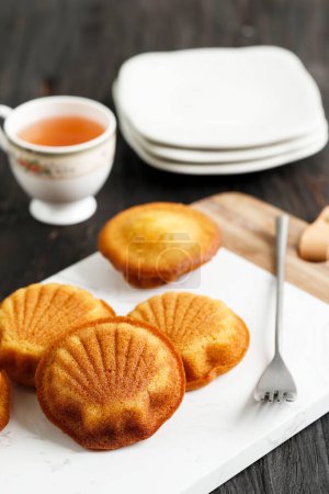 Photo for Madeleine French Butter Cake  with Shell Shape, Served with Tea - Royalty Free Image