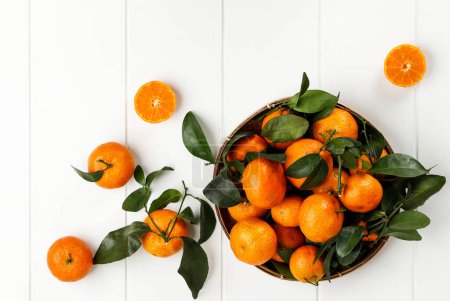 Photo for Jeruk Santang Madu Mandarin Orange Citrus sinensis, Usually Served for Chinese New Year. Top View on White Table - Royalty Free Image