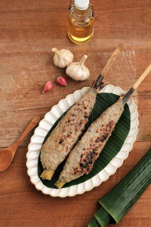 Photo for Sate Bandeng, Traditional Cuisine from Banten, Indonesia. Sate Bandeng is Made from Deboned Milkfish Mixed with Coconut Milk, Grated Coconut and Spices. Inserted Back into the Fish Skin - Royalty Free Image