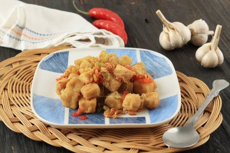 Photo for Tahu Cabe Garam or Salt and Pepper Tofu, Crispy Cubed Deep Fried Tofu with Garlic and Chilli Flakes. Popular as Tahu Lada Garam - Royalty Free Image