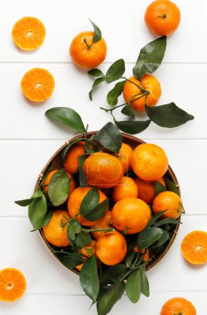 Photo for Jeruk Santang Madu Mandarin Orange Citrus sinensis, Usually Served for Imlek Chinese New Year. Top View on White Table - Royalty Free Image