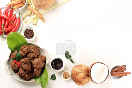 Photo for Coconut, Chilli with Spice and Herbs for Making Rendang Padang. Copy Space above White Background. - Royalty Free Image