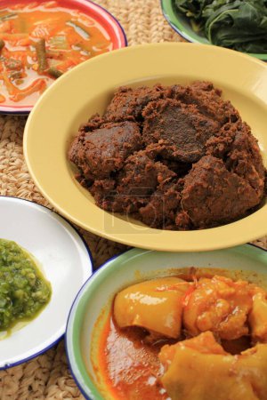 Photo for Selected Focus Rendang or Randang is The Most Delicious Food in the World. Made from Beef Stew and Coconut Milk with Various Herbs and SPice. Typically food from Minang Tribe, West Sumatera, Indonesia - Royalty Free Image