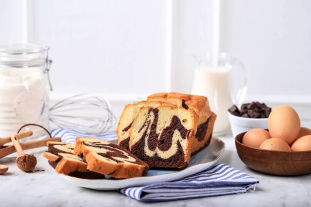 Homemade Chocolate and Vanilla Marble Loaf Cake. Sliced Served with Tea or Coffe. White Background