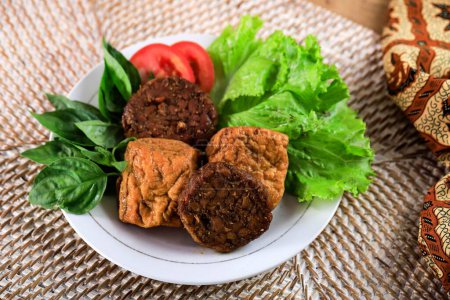 Photo for Tahu Tempe Bacem, One Various Indonesian Cullinary FOod Made from Soy Product, Tempeh and Tofu Seasoned with Various Spice. Taste Sweet and Delicious - Royalty Free Image