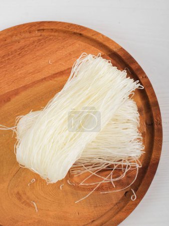 Photo for Top View Raw rice noodles, Raw Vermicelli Noodles in Kitchen Ready to Cook. Isolated on White - Royalty Free Image