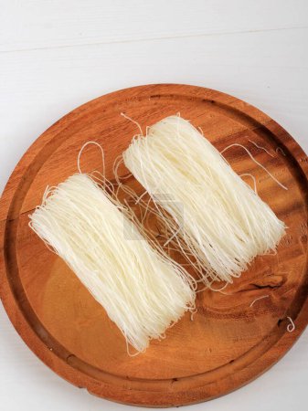 Photo for Raw Glass Rice noodles, Raw Vermicelli Noodles in Kitchen Ready to Cook. - Royalty Free Image