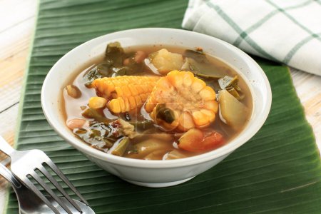 Photo for Sayur Asem or Sayur Asam, Vegetable Tamarind Clear Soup, Popular Indonesian Vegetarian Daily Menu - Royalty Free Image