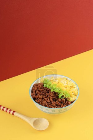 Photo for Tori Soboro Rice Bowl, Japanese Rice Bowl with Scrambled Egg and Minced Chicken - Royalty Free Image