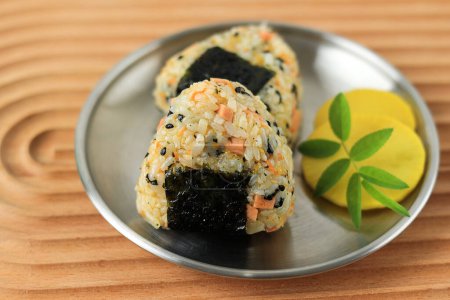Photo for Close Up Triangle Onigiri with Sesame Seed, Sausage, Nori, and Ham - Royalty Free Image