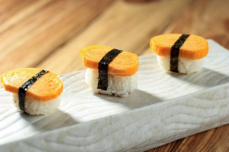 Photo for Tamago Nigiri Egg Sushi with Nori, Close Up - Royalty Free Image