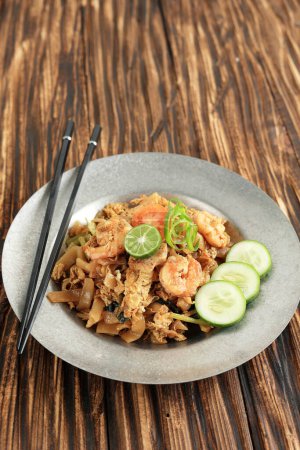 Photo for Char Kuey Teow or Kwetiaw with Big Prawn, Chinese Food Made from Stir Fry Rice Noodles with Vegetable, Egg, and Seafood - Royalty Free Image
