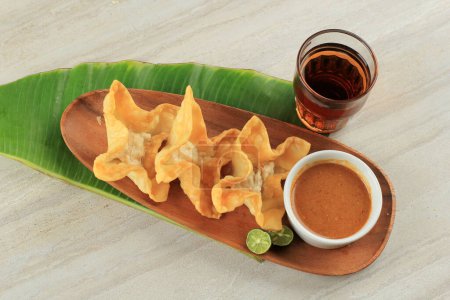 Photo for Fried Batagor, Baso Tahu Goreng. Indonesia Snacks Food Served with Peanut Sauce - Royalty Free Image