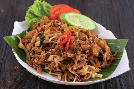Photo for Kwetiaw or Kwetiau, Fried Rice Flat Noodles with Chicken, Meatballs, and Various Vegetables. Popular Chinese Food in Indonesia - Royalty Free Image