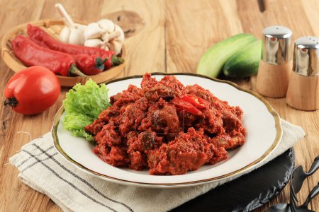 Sambel Daging, Spicy Fried Meat Indonesian Food. Beef with Red Balado Sauce 