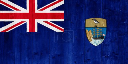 Flag of the British Overseas Territory of the Saint Helen Island on a textured background. Concept collage.