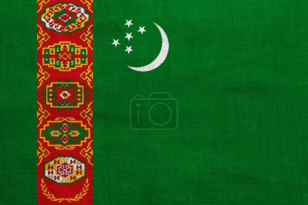 Téléchargez les photos : Drapeau du Turkménistan sur fond texturé. Collage conceptuel. - en image libre de droit