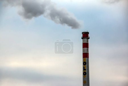Photo for Bratislava, Slovakia - 01.12.2024: Oil refinery. Pipe with smoke against the sky. - Royalty Free Image