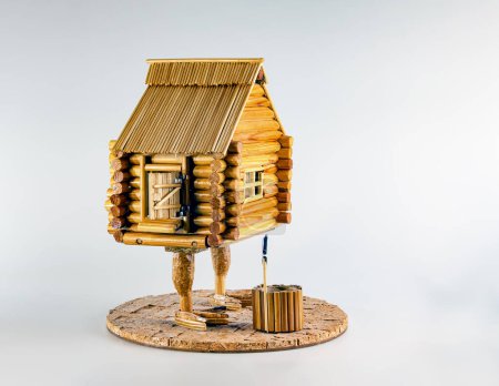 A figurine of a wooden house on chicken legs. Baba Yaga's house. Handmade.