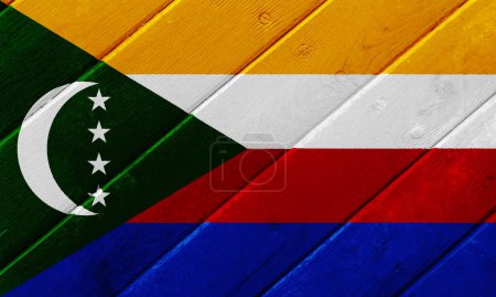 Flag of Union of the Comoros on a textured background. Concept collage.