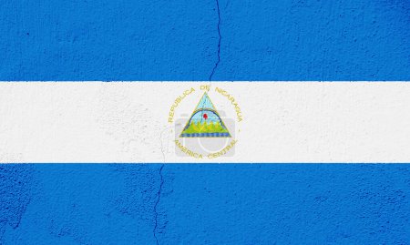 Drapeau de la République du Nicaragua sur fond texturé. Collage conceptuel.