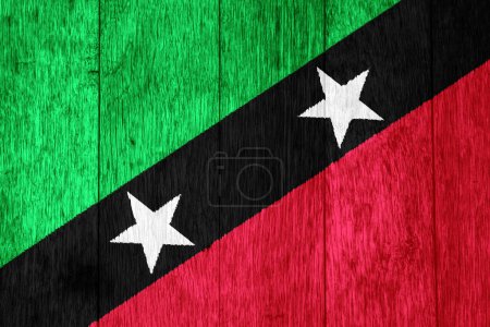 Flagge der Föderation von Saint Christopher and Nevis auf einem strukturierten Hintergrund. Konzeptcollage.
