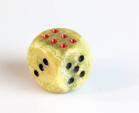 Onyx dices with red and black dots against white background