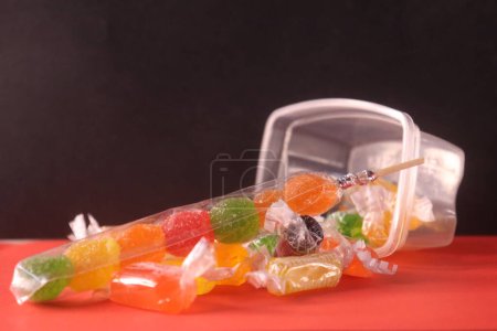 Photo for Colorful sweet candies out of the box - Royalty Free Image