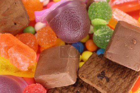 Mix Colorful Candies With Biscuits Closeup