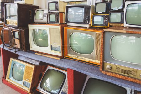 Photo for Many retro television. vintage old TV is colorful multi-row. Seeing the past. Pattern wall of old Antique television (TV). Television concept. Media - Royalty Free Image