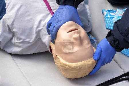 Hands on a mannequin. A person teaches the provision of first aid. CPR First Aid Training Concept.Urgent Care.
