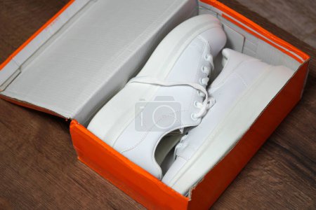 Photo for White new sneakers in a box. Purchase of sports shoes. Stylish sports shoes concept - Royalty Free Image