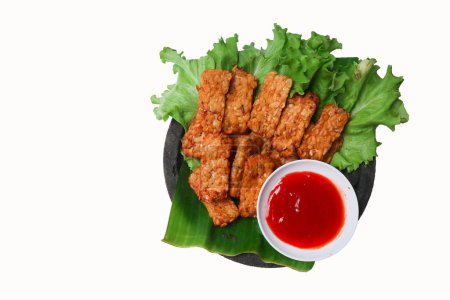 Tempeh, Tempe Goreng or Fried tempeh is Indonesia traditional food, made from fermented soybean seeds. with sambal (chilli sauce), isolated white background