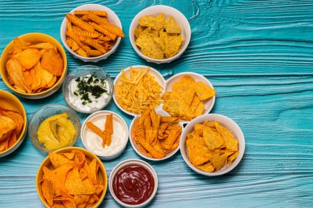 Photo for Salty snacks assortment and dipping sauce - Royalty Free Image
