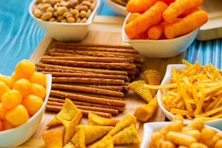 Photo for Salty snacks served as party food in bowls. Party food - Royalty Free Image