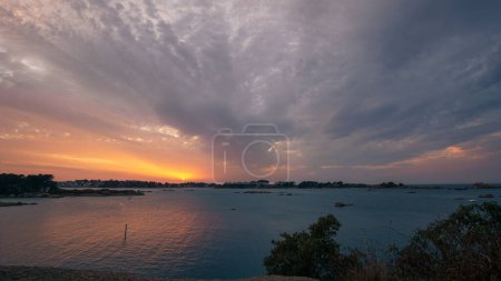 Photo for Baie de Sainte-Anne at Ploumanac'h during sunset on a summer evening with islands, Cote de Granit Rose Brittany , France - Royalty Free Image