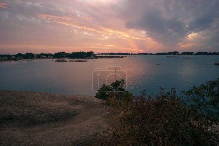 Photo for Bay of Ploumanac'h during sunset on a summer evening with islands, Cote de Granit Rose Brittany , France - Royalty Free Image