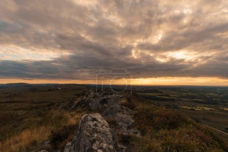 Photo for Rocky landscape at Roc'h Trevezel summit on a autumn evening during golden hour at sunset, Parc naturel regional d'Armorique, Brittany, France - Royalty Free Image