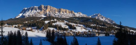 Panorama of dolomite massif during winter time with snow covered mountain peaks in Alta Badia at nature park Fanes-Sennes-Prags, South Tirol, Italy